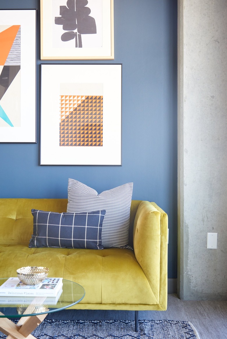 Eclectic living room with yellow couch